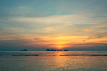 Spectacular colorful sunset over sea and islands on a summer evening. 