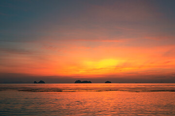 Spectacular colorful sunset over sea and islands on a summer evening. 