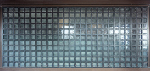 Glass wall shielded by metal lattice. The classic design of Japanese style.