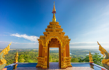 Lanna style art of golden door facade entrance of Wat Phra That Doi Phra Chan. The Buddhist temple...