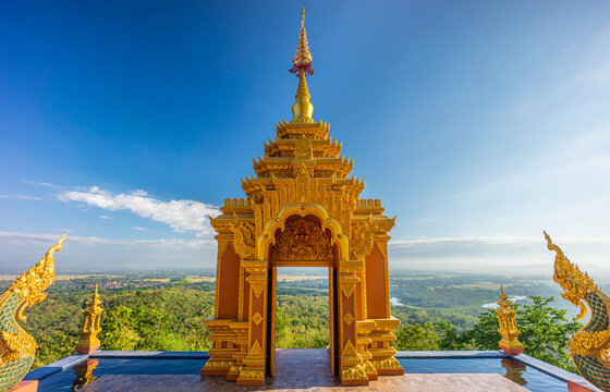 Lanna style art of golden door facade entrance of Wat Phra That Doi Phra Chan. The Buddhist temple on the top hill of Doi Phra Chan mountain in Mae Tha, Lampang, Thailand.