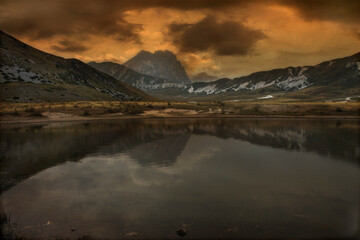 view of lake in Abruzzo with Gran Sasso mountain in background