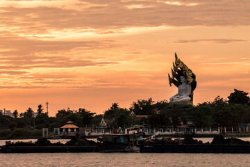 Sunset river landscape in Thailand with Naka God of Snake Statue 