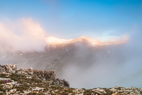 Amazing golden sunlight over the peak (Peak of Bastiments, Pyrenees Mountains, Catalonia, Spain, Ulldeter)