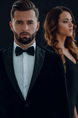 gentleman with his girl posing in the studio