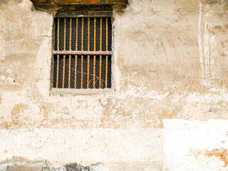 Fototapeta na wymiar old ancient window with steel window vintage style on rustic concrete wall