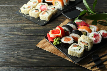 Concept of tasty food with sushi, space for text