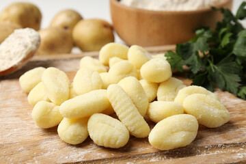 Concept of cooking with raw potato gnocchi, close up