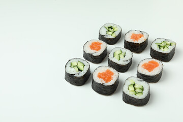 Concept of tasty food with maki on white background