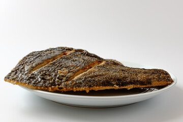 Grilled flounder on a white background