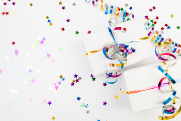 Festive decorations and notebook with wish list on white background , flat lay . Planning concept.- Image