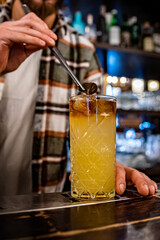 man hand bartender making cocktail on the bar counter