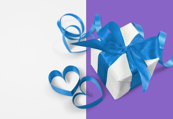 Beautiful gift box with ribbon wrapped as bow abstract background