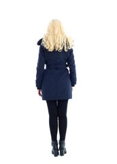 full length portrait of blonde woman wearing long winter coat. and casual clothes. standing pose, isolated on a white studio background.