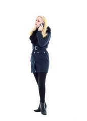 Fototapeta premium full length portrait of blonde woman wearing long winter coat. and casual clothes. standing pose, isolated on a white studio background.