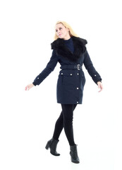 Fototapeta premium full length portrait of blonde woman wearing long winter coat. and casual clothes. standing pose, isolated on a white studio background.