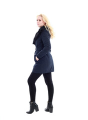 Fototapeta premium full length portrait of blonde woman wearing long winter coat. and casual clothes. standing pose, isolated on a white studio background.