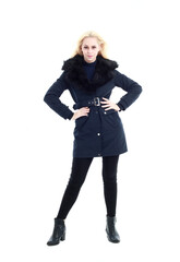 Fototapeta premium full length portrait of blonde woman wearing long winter coat. and casual clothes. standing pose, isolated on a white studio background.