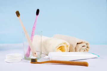 toothbrush and paste on a blue background. Background with copy space. Oral hygiene concept.