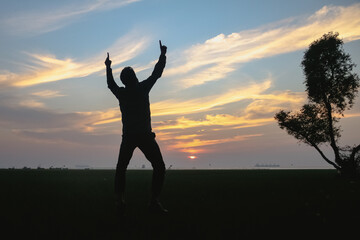 silhouette of a person at sunset