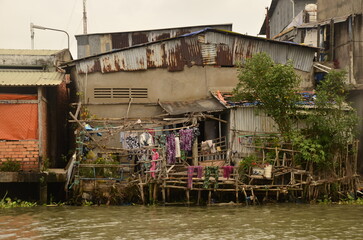 A floating house while sailing the Mekong river delta. Different Vietnam images, streets, markets, rivers, beaches, and national parks.
