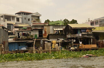A floating house while sailing the Mekong river delta. Different Vietnam images, streets, markets, rivers.