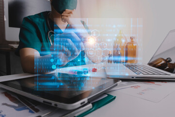 Medicine doctor touching on tablet and digital healthcare and network connection with modern virtual screen interface icons on the hospital background, Medical technology and network concept.