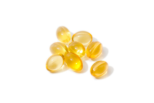 Close up of  oil filled capsules suitable for: fish oil, omega 3, omega 6, omega 9,  vitamin A, vitamin D, vitamin D3, vitamin E - Image
