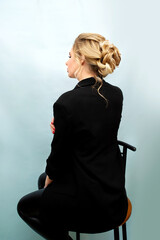 Young fashion model with perfect skin, makeup and beautiful hair. Back view. Happy day.