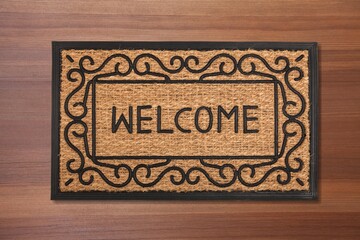 Cozy Coir Doormat on wooden floor in front of the door. Product mockup