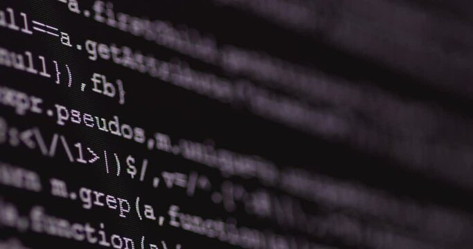 4K Close up shot programming tag code on PC Monitor scroll down. Background concept for programming and coding web development.