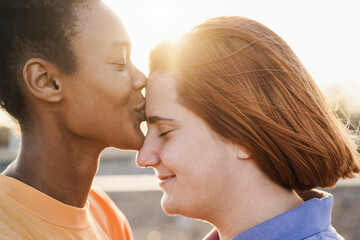 Happy women gay couple having tender moment outdoor - Lgbt and love concept
