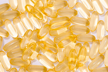 Close up of  oil filled capsules suitable for: fish oil, omega 3, omega 6, omega 9,  vitamin A, vitamin D, vitamin D3, vitamin E - Image