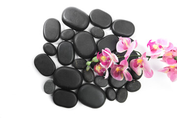 black spa stones isolated on white background .