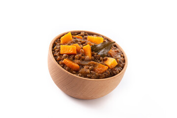 Lentil stew ragout with pumpkin and carrot in bowl isolated on white background