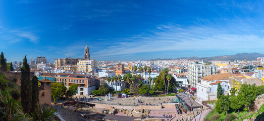 Fototapeta na wymiar Panoramic view of big city, the cathedral of Malaga, church of St. Augustine and roman theatre. Costa del Sol. Malaga. Andalusia. Spain.