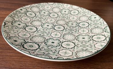 empty porcelain plate with a green pattern