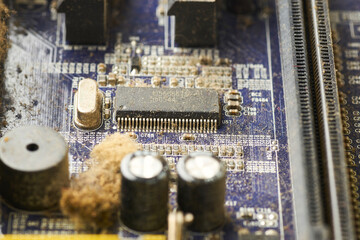 Old computer system unit with spiderweb and dust inside.