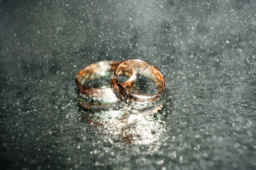 Holding wedding rings. Noble metal jewellery for married couples.Wedding ceremony and planing.Holding traditional bridal commitment jewellery.Golden ring for bride and groom.Marriage proposal exchange