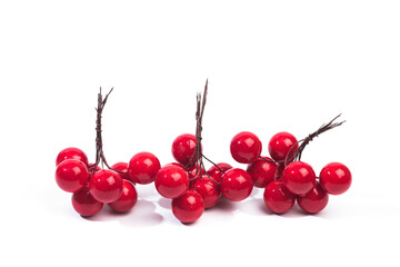 .christmas decoration red berries in bunches isolated on white background .