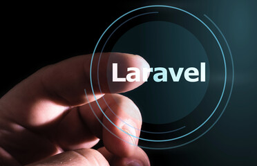 Hand pressing Laravel  button on virtual screens. Laravel PHP Framework programming language.
