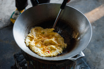 Thai style omelet in Thai street food restaurant