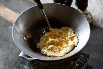 Thai style omelet in Thai street food restaurant