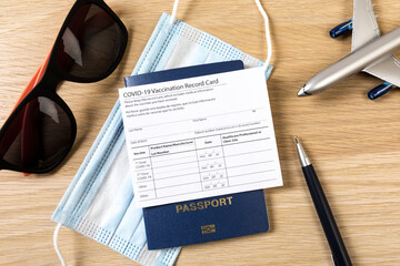 COVID-19 vaccination record card and tourist passport  for worldwide travel during coronavirus pandemic. - Image