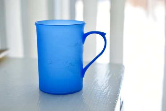 Blue Plastic Mug On A White Background