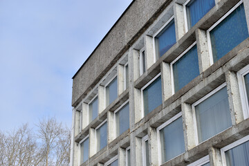 An old stone building with large windows