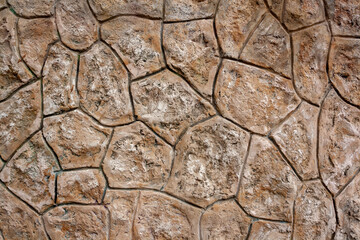 Wall is made of stones well fitted to each other. Stone background. Horizontal photo.