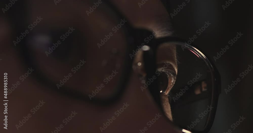 Leinwandbilder 4K Video Close up macro asian eye with eyeglass with coding reflection. Concept for coding and programming.
