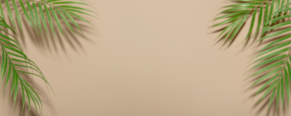 Fototapeta na wymiar Creative layout made of colorful tropical leaves on beige background