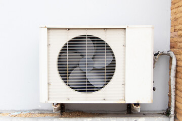 Air old conditioner compressor source heat pumps on the wall outdoor on the roof top of building...
